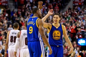 Nov 2, 2014; Portland, OR, USA; Golden State Warriors guard Klay Thompson (11) and guard Andre Iguodala (9) high five during the fourth quarter against the Portland Trail Blazers at the Moda Center. Mandatory Credit: Craig Mitchelldyer-USA TODAY Sports